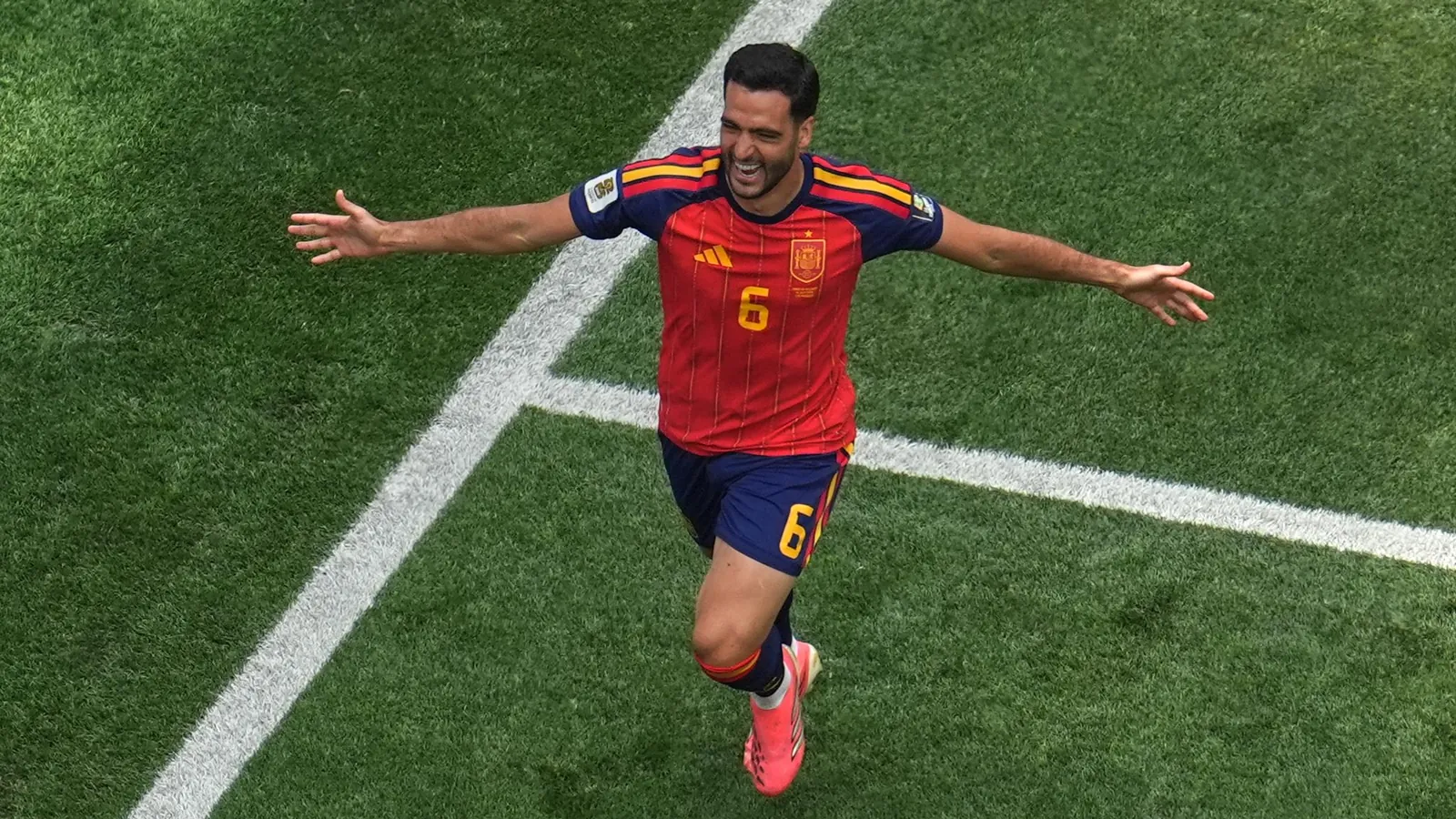 Spain's Mikel Merino (6) celebrates scoring their second goal