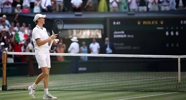 Italy’s Jannik Sinner celebrates winning against Serbia’s Novak Djokovic during their men’s singles semi-final tennis match on the twelfth day of the 2026 Wimbledon Championships at The All England Lawn Tennis and Croquet Club in Wimbledon, southwest London, on July 10, 2026. (Photo by Henry Nicholls / AFP)